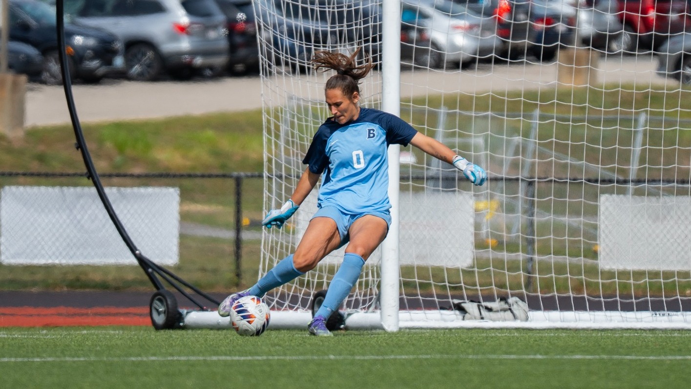Amaya Logan kicks a goal kick during a soccer match