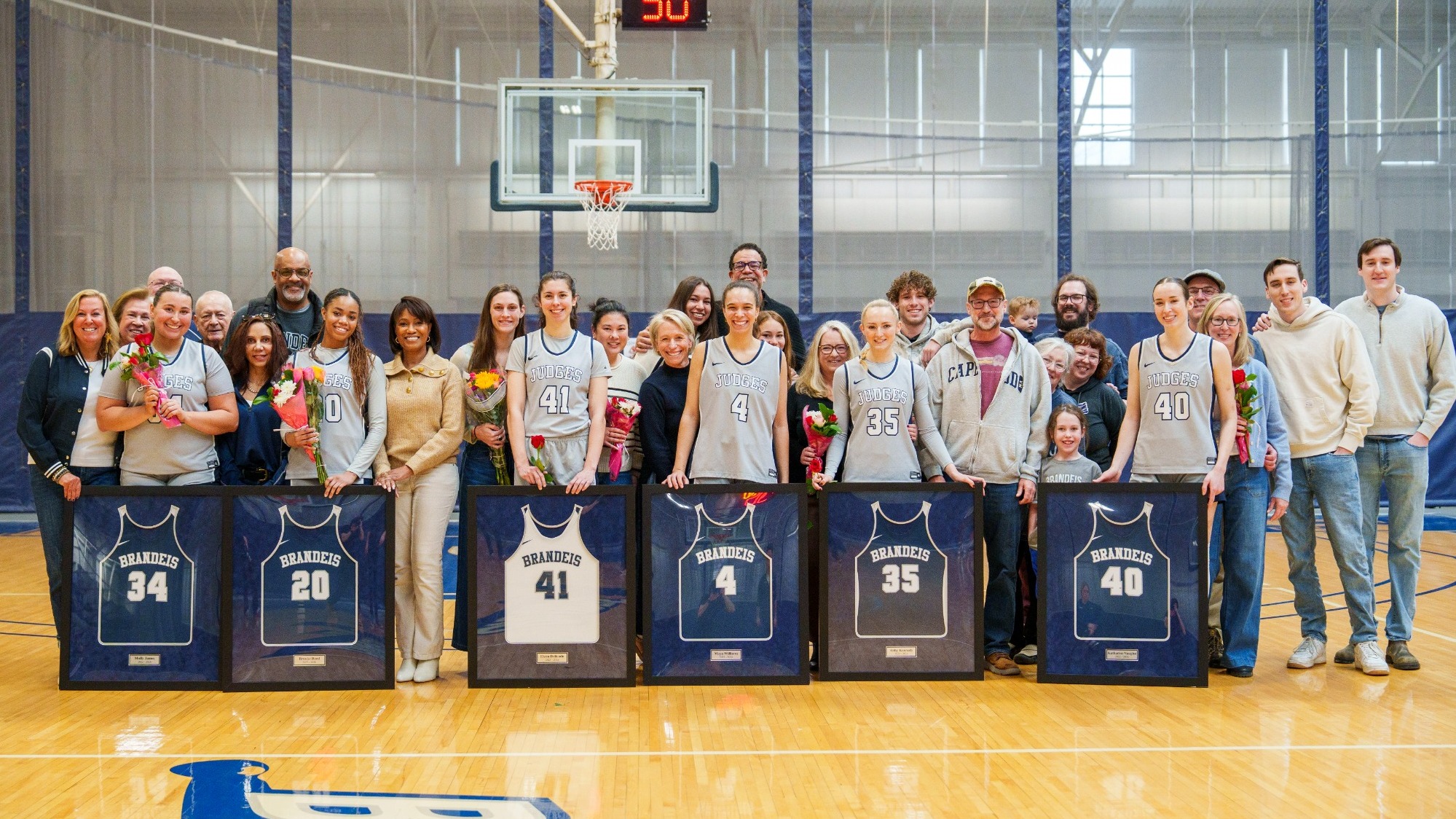 Brandeis Women's Basketball Seniors are honored with their families before the game