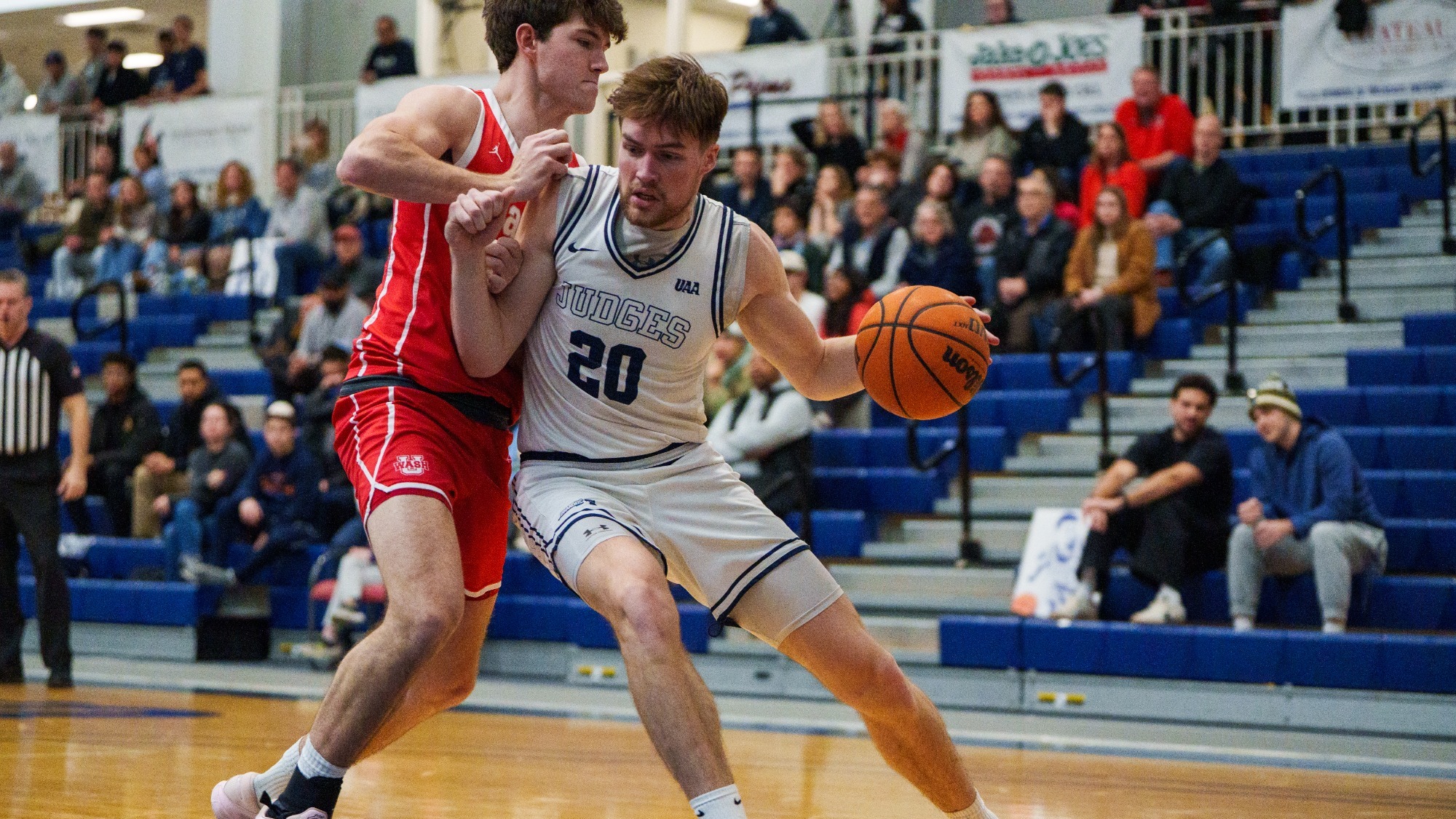 Elias Rodl drives to the basket with a defender on him
