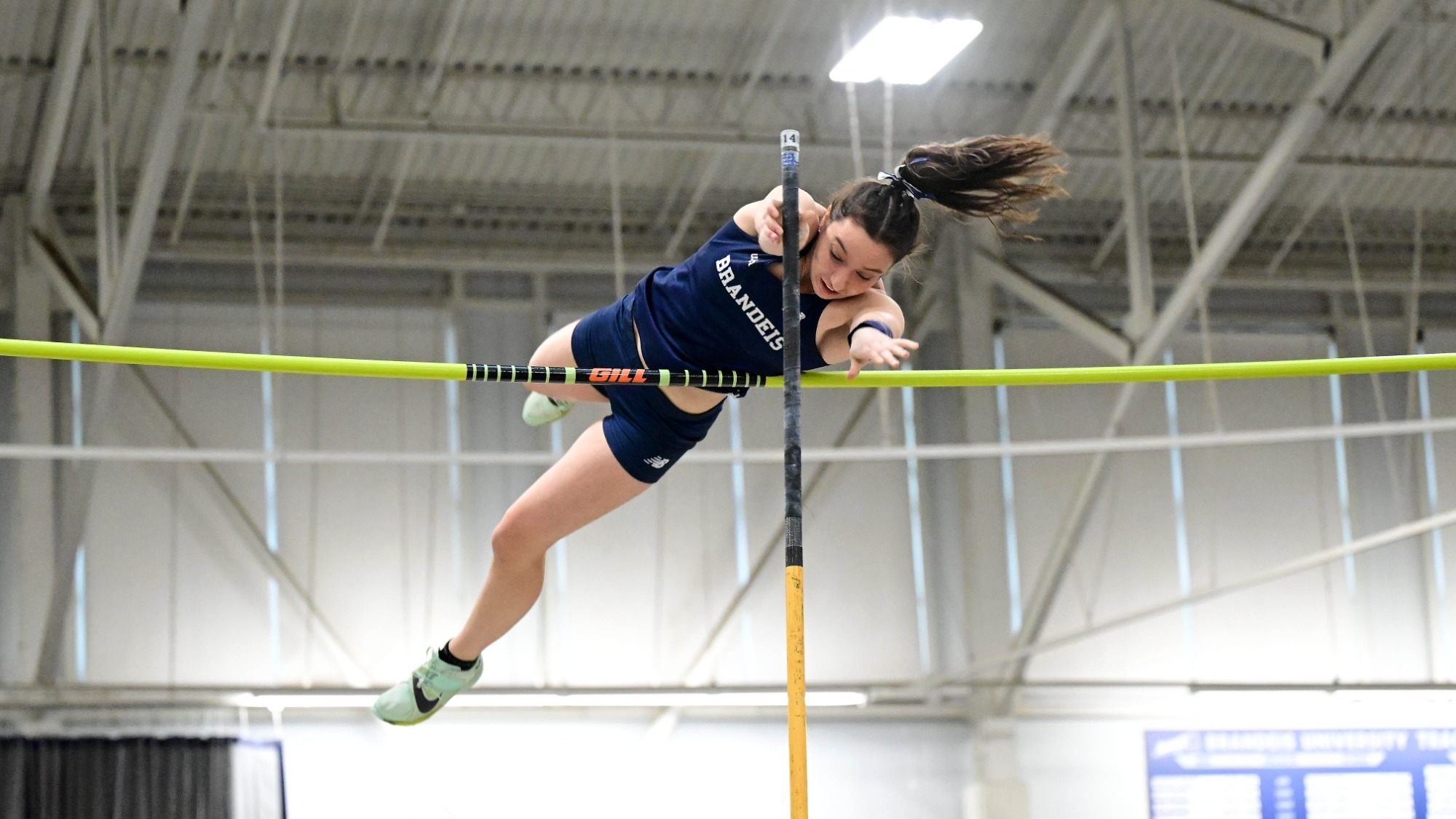 Alisha Anderson clears the bar during a pole vault attempt