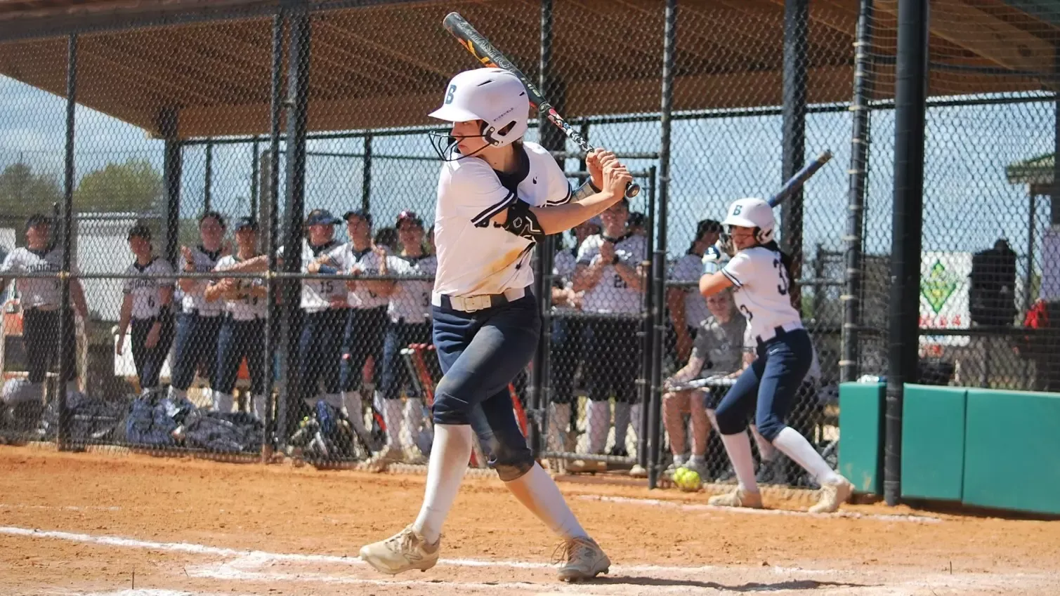 Erin Hunt swinging in the batter's box during a softball game