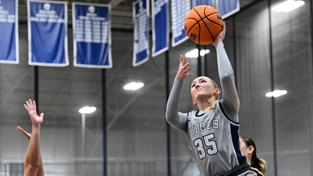 Abby Kennedy goes for a lay-up during a basketball game