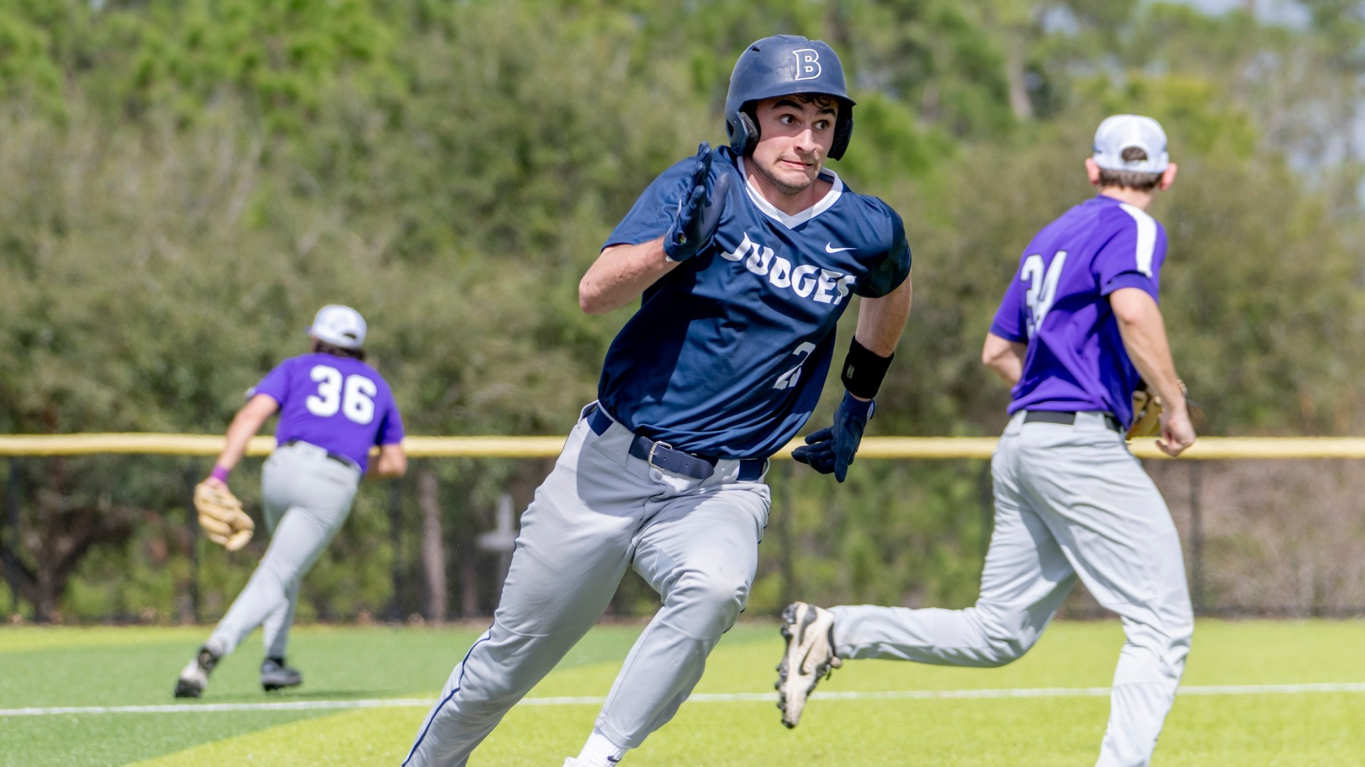 Danny Tambascia rounding third and heading for home during a baseball game