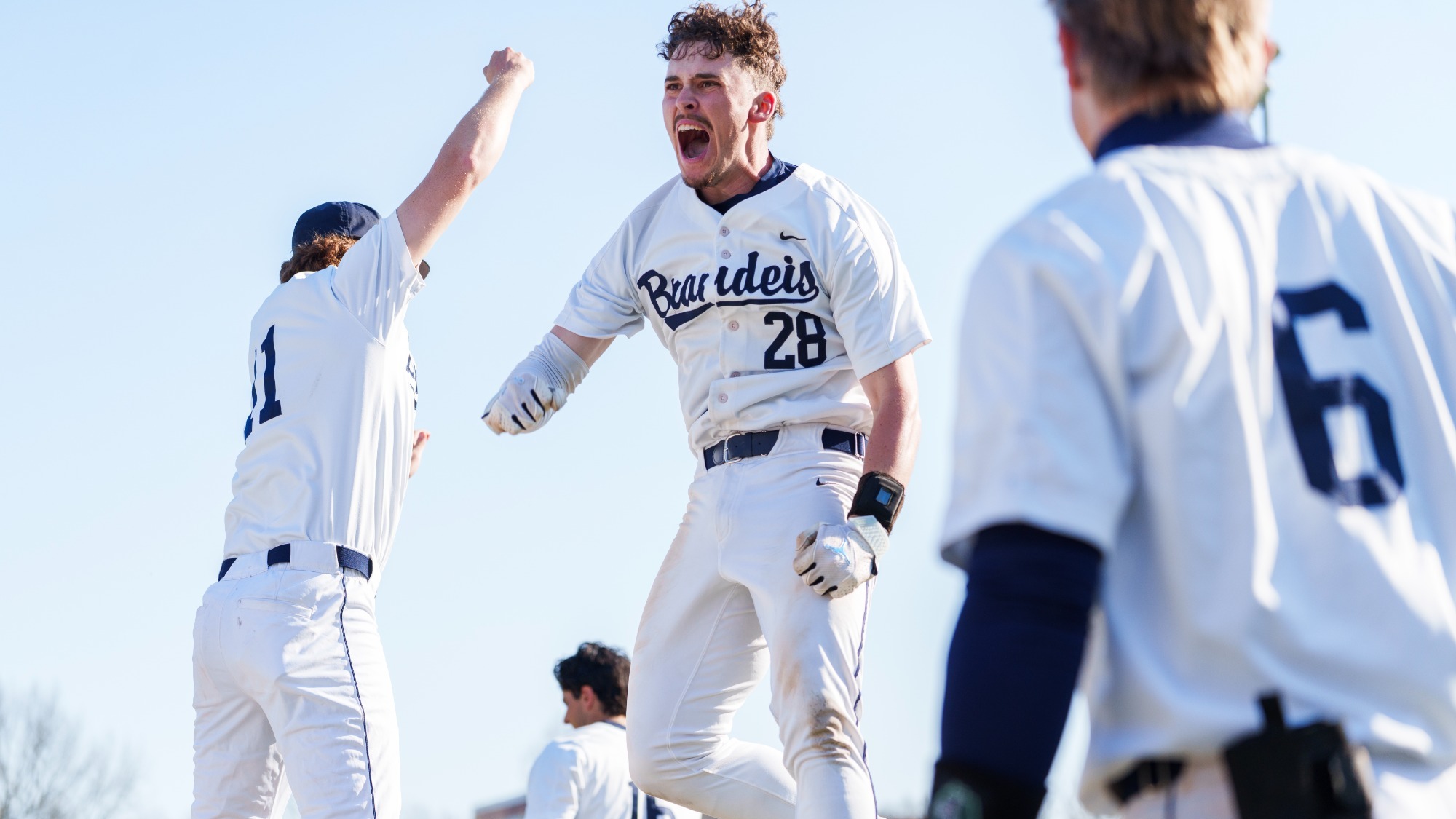 Henry Aronwald celebrates a home run in a baseball game against NYU