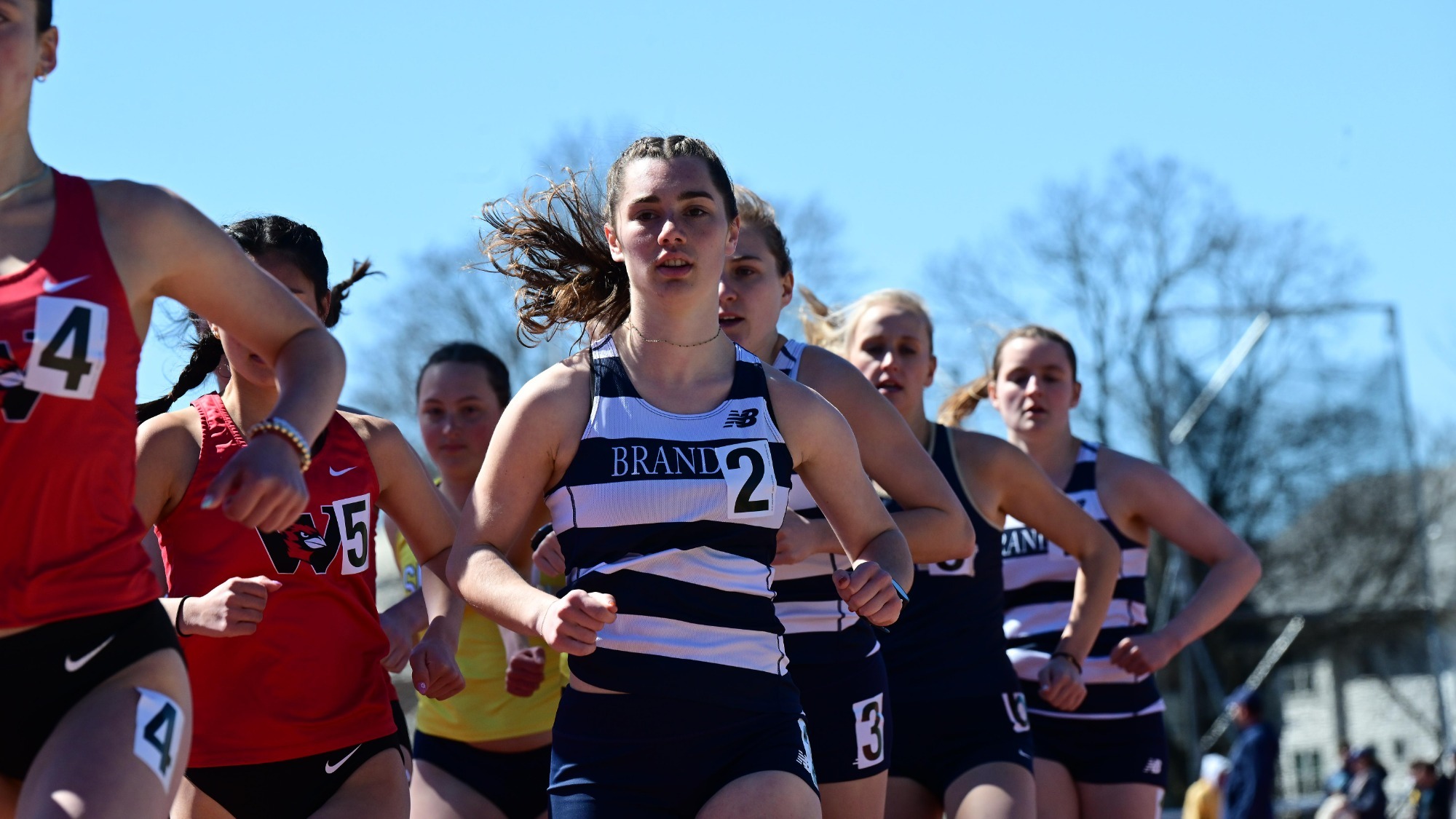 Sadie Harrow running a race during an outdoor track meet