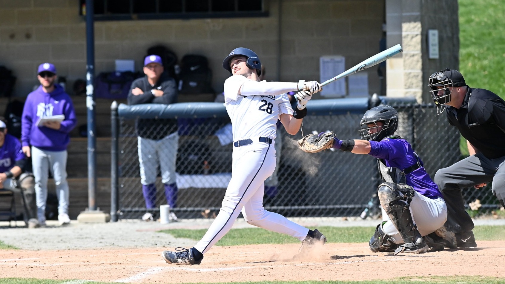 Henry Aronwald follows through on a swing during a baseball game