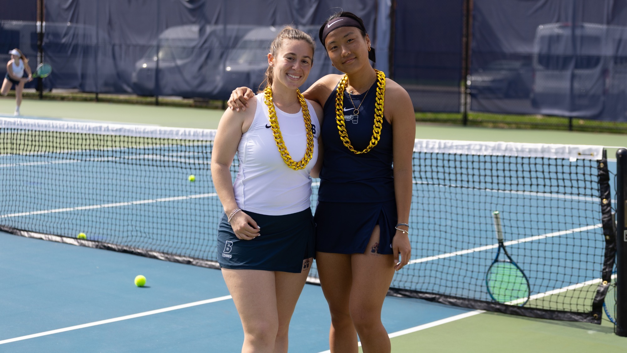 Women's Tennis seniors Rebecca Suarez and Nancy Zhang pose for the camera before their Senior Day match