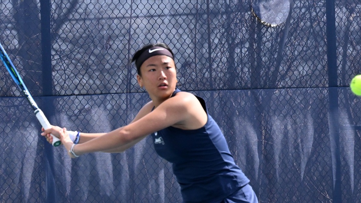 Nancy Zhang gets ready to return a tennis ball during a match