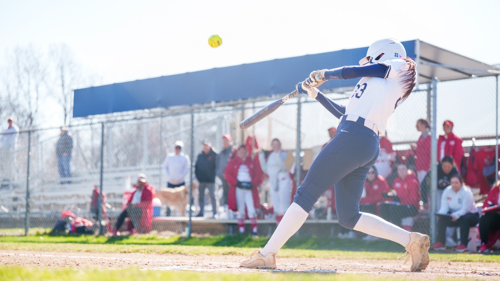 Bells Burdenski hits a ball during a softball game