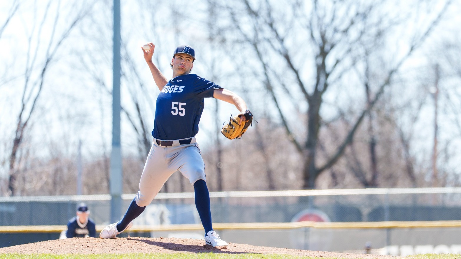 Andrew Tringe throws a pitch in a baseball game