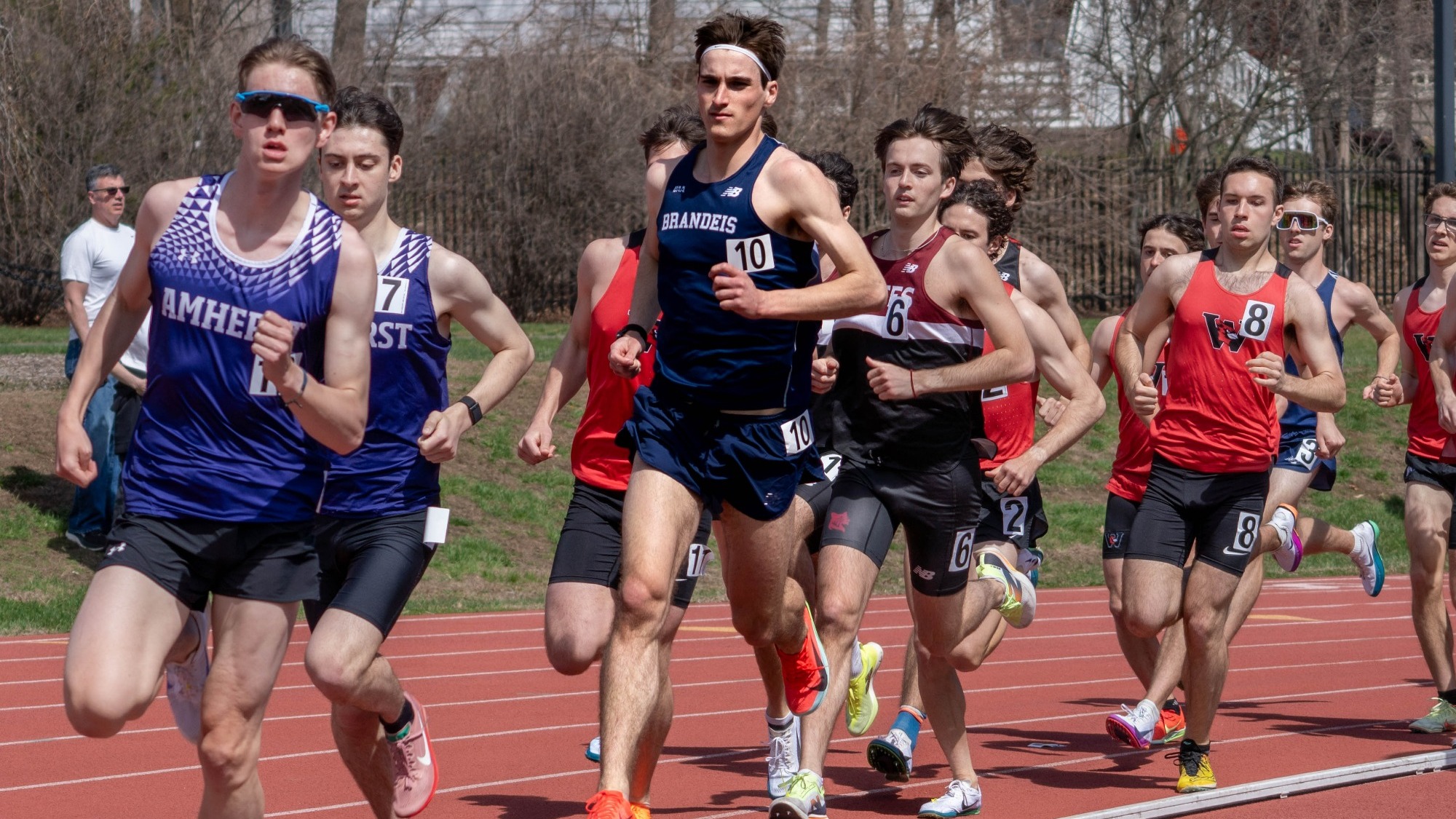 Hugh Licklider running among a pack during a track and field race