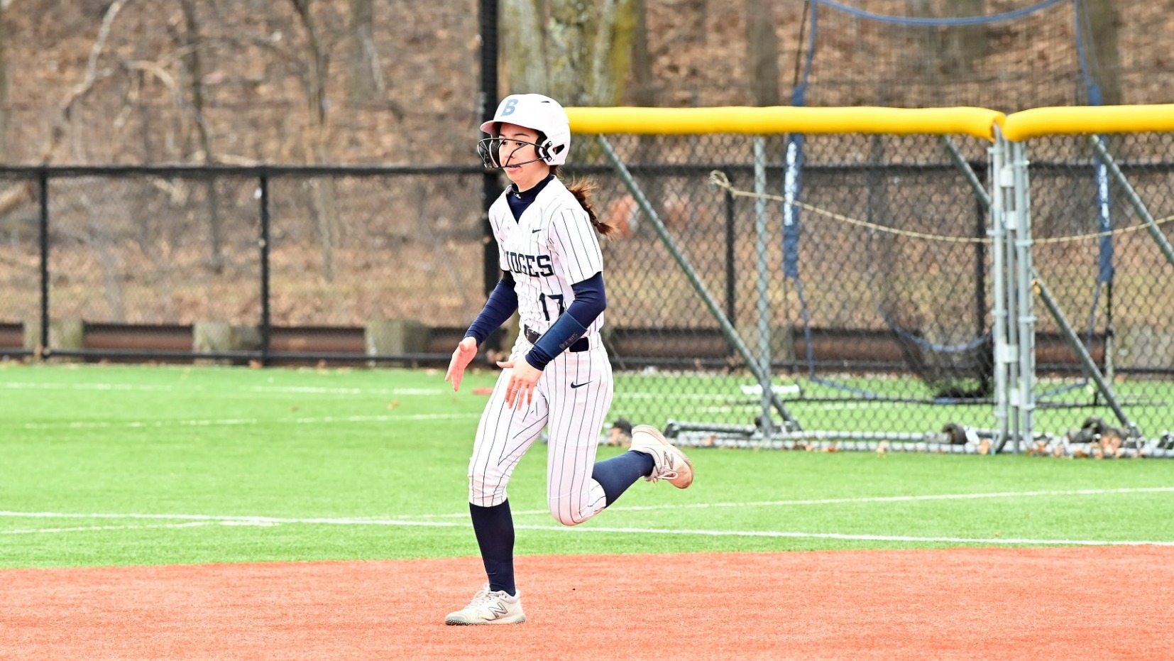 Erin Hunt running to second base during a softball game