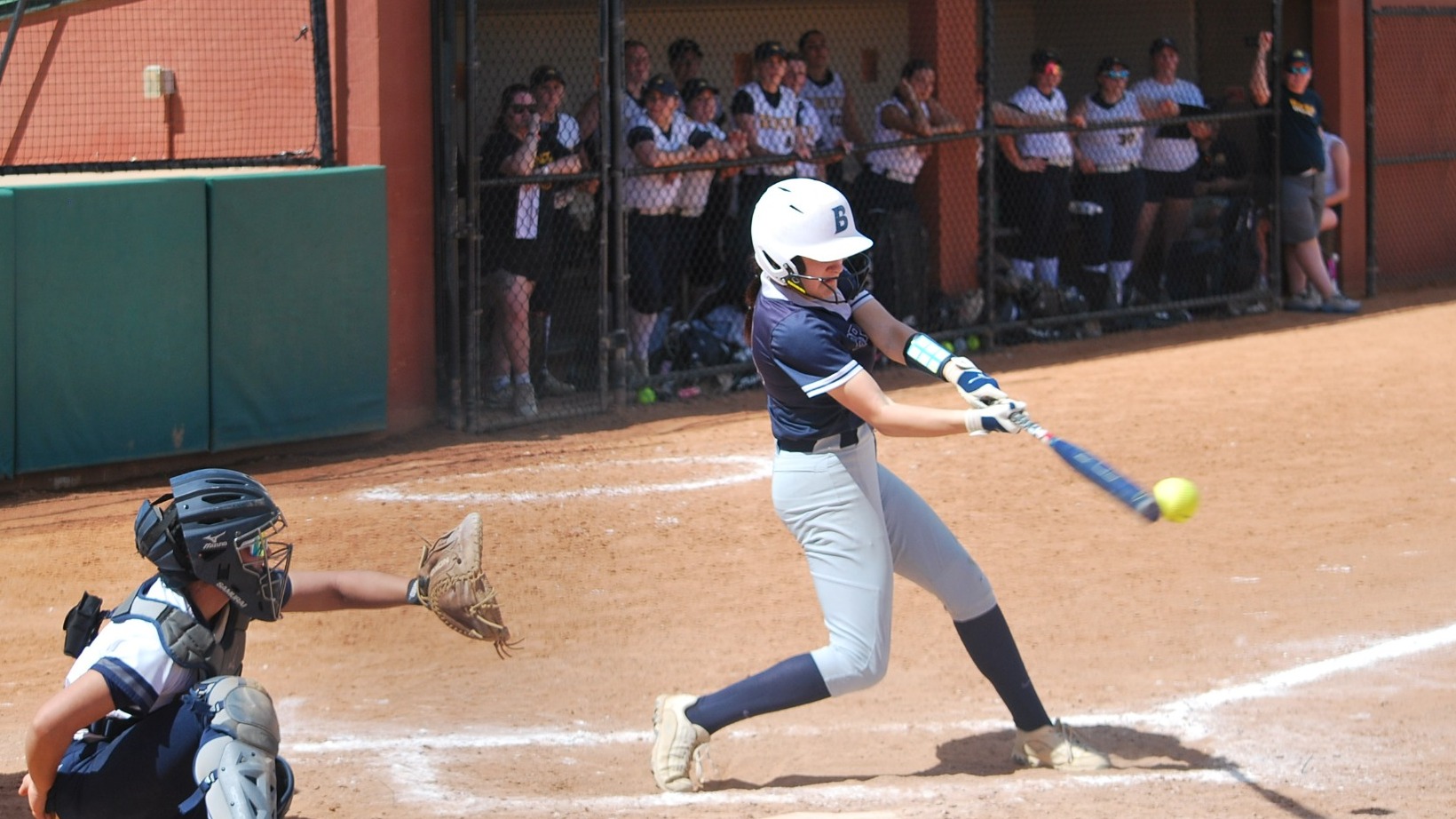 Belle Burdenski connects with a ball during a softball game