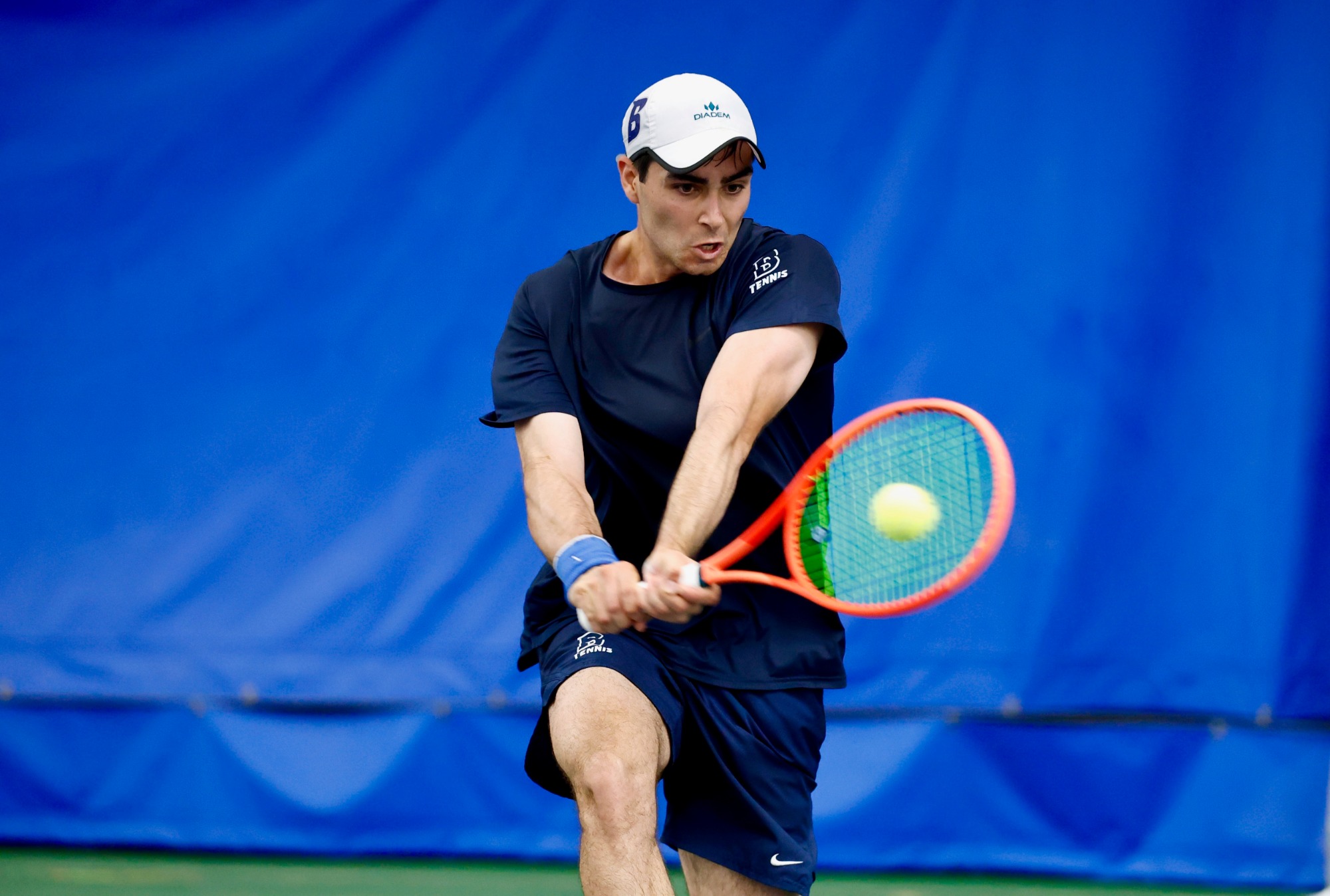 Danny Shemesh hits a two-handed backhand during the NCAA Division III Singles Tournament