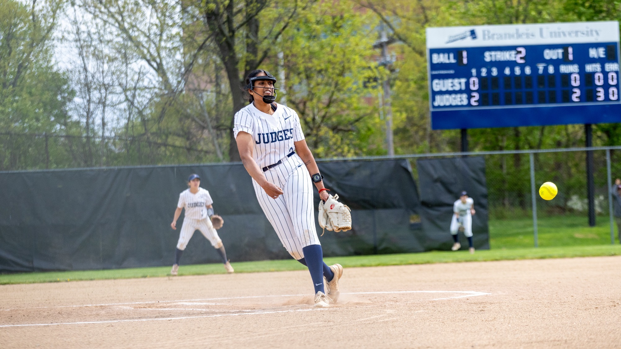 Ragini Kannan throwing a pitch during a softball game