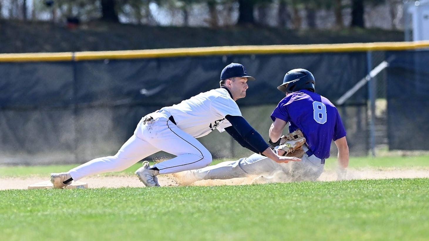Matt Chafin applies a tag at second base on a sliding opponent