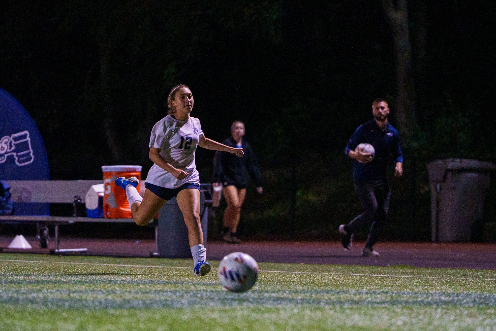 Abby Finkelstein chases down a soccer ball during a game