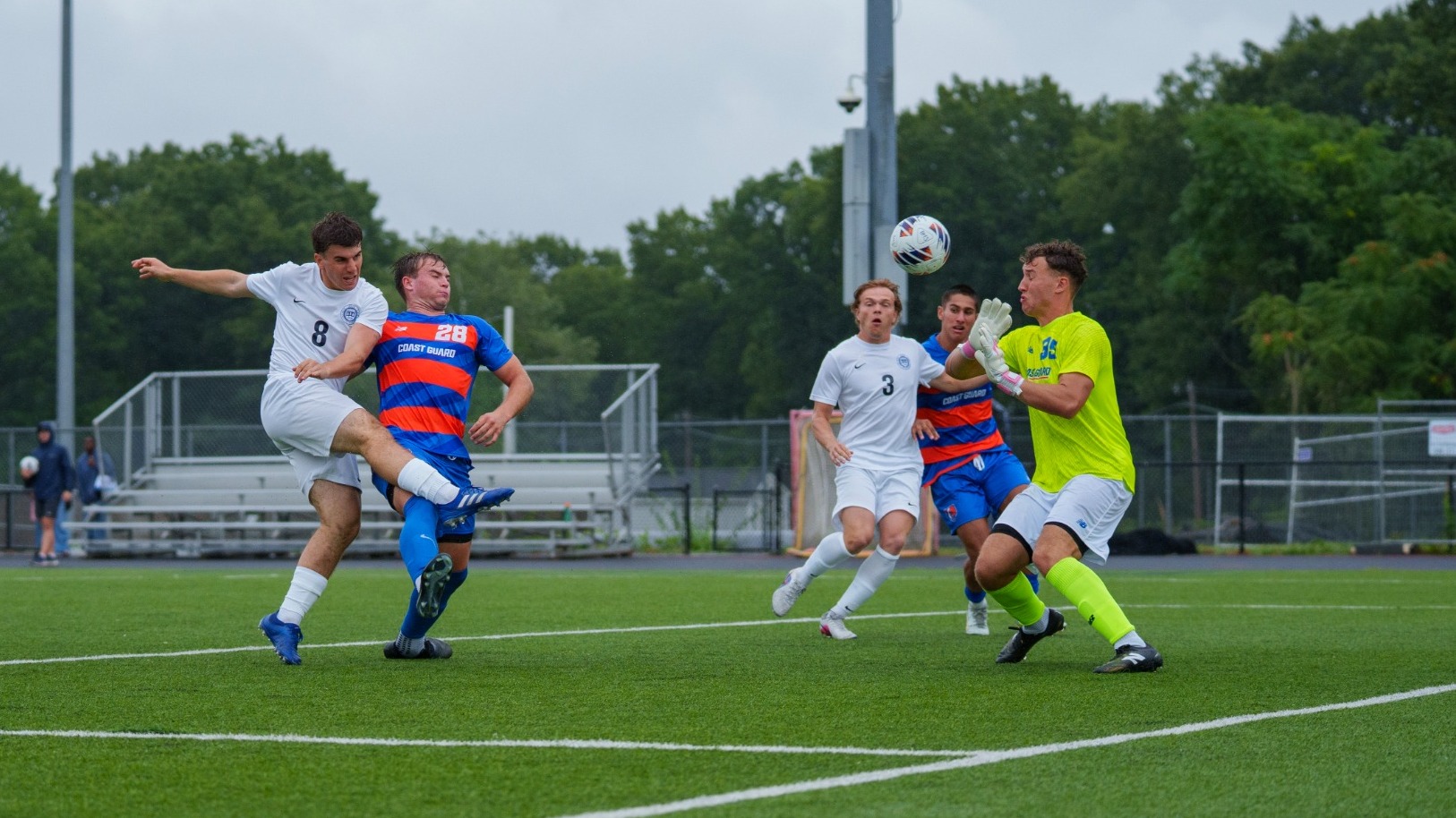 Charlie Culbert kicks a soccer ball past an opposing goalie for his first collegiate goal