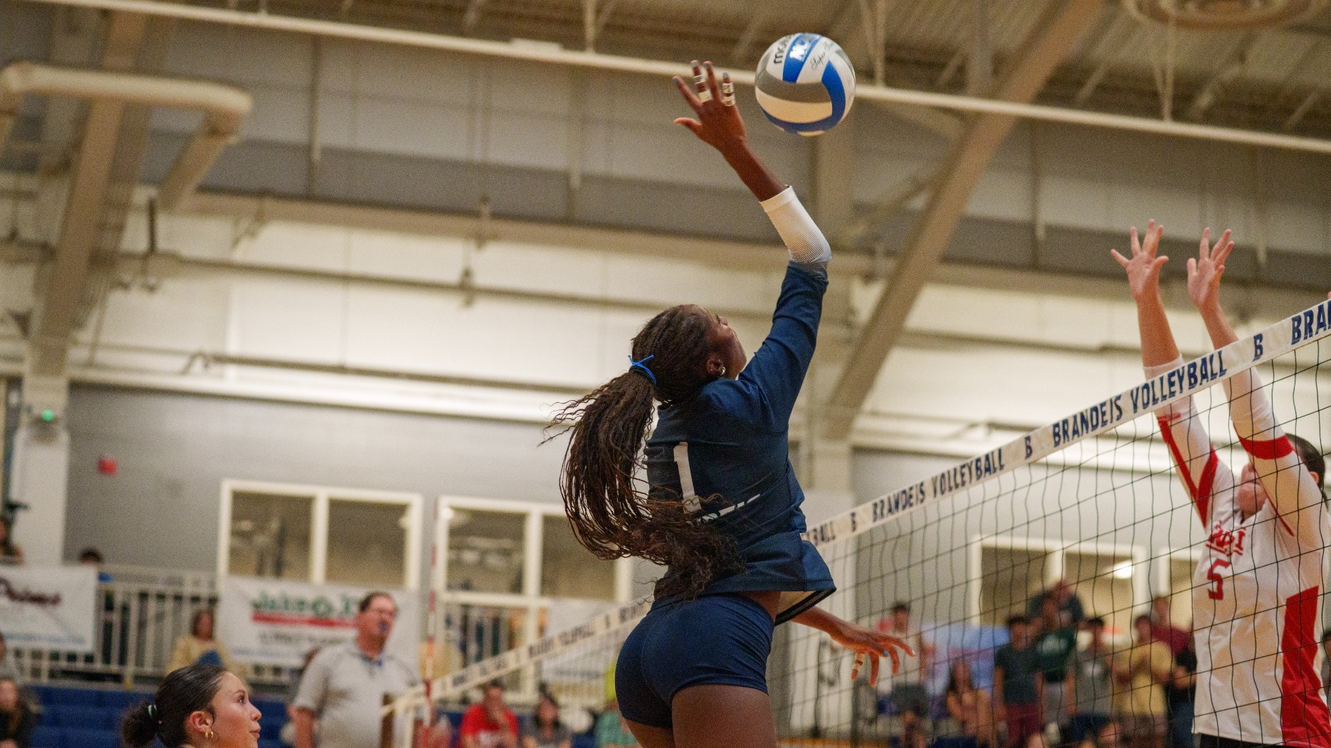 Kennedy Hilson goes on the attach during a volleyball match