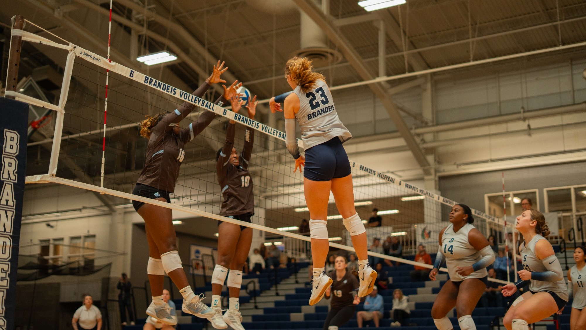 Madison Haft-Abromovitch skies to attack a volleyball during a match
