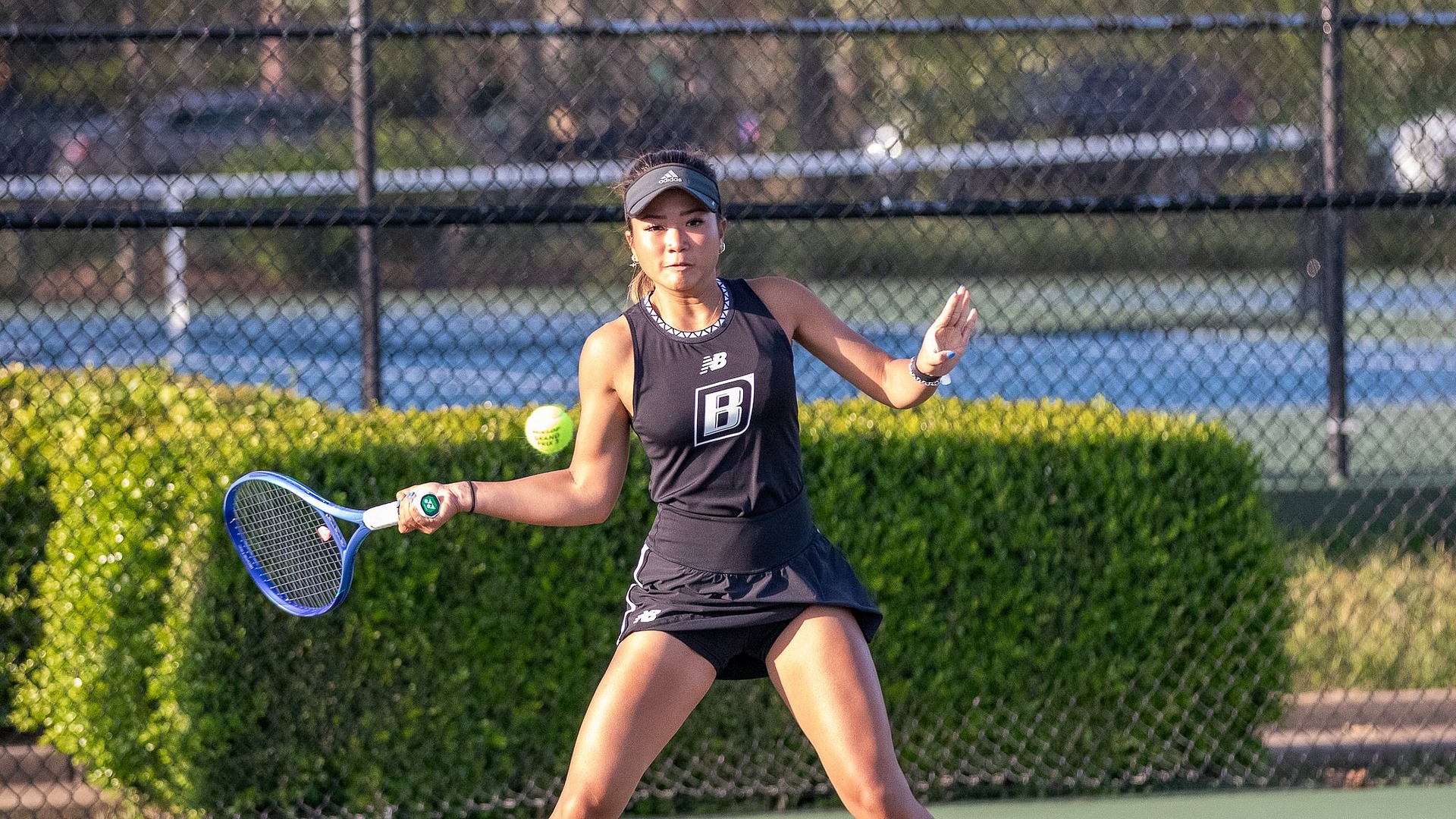 Isman preparing to hit a forehand shot