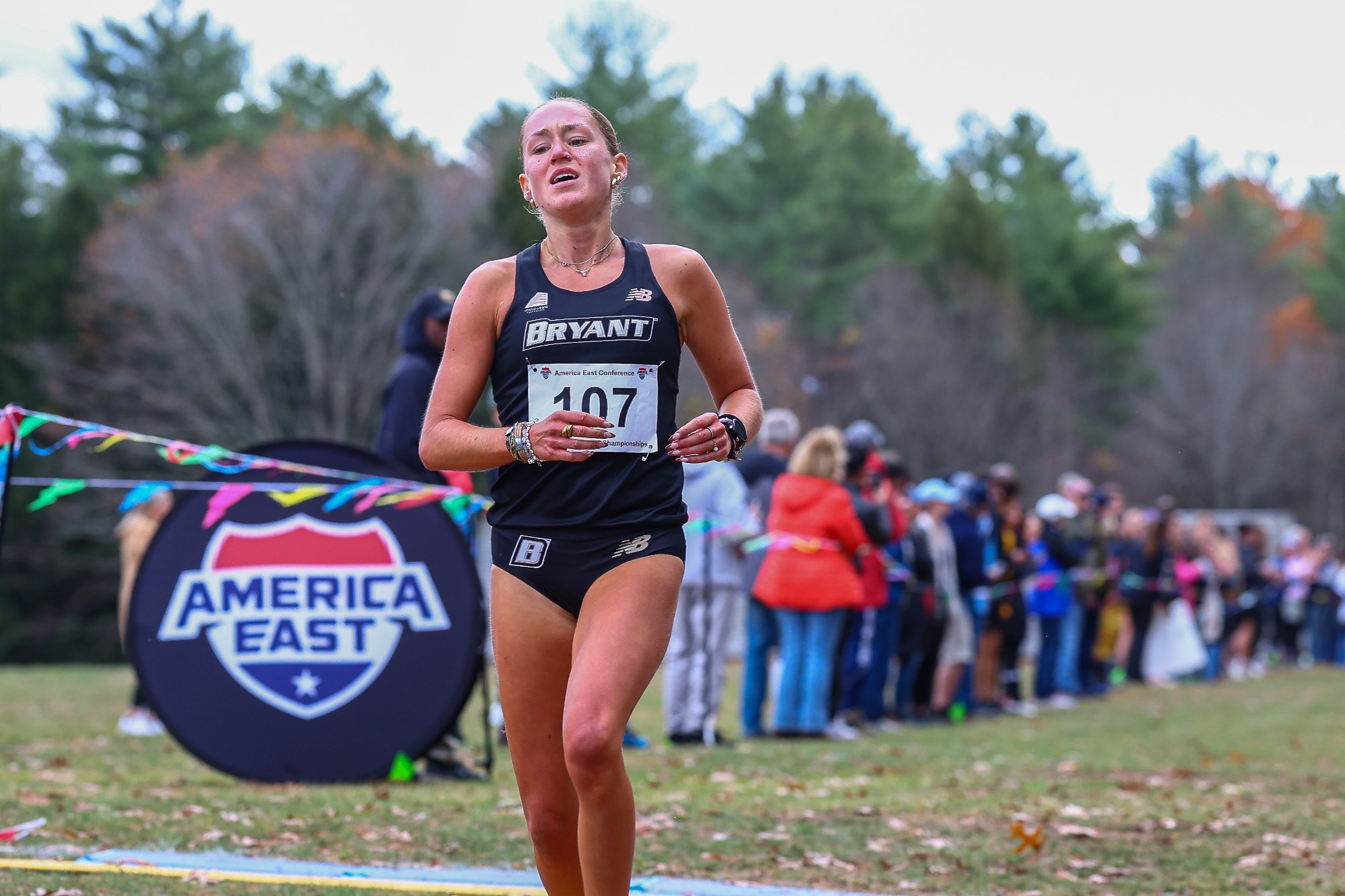 jasmine trott about to cross the finish line to win the meet