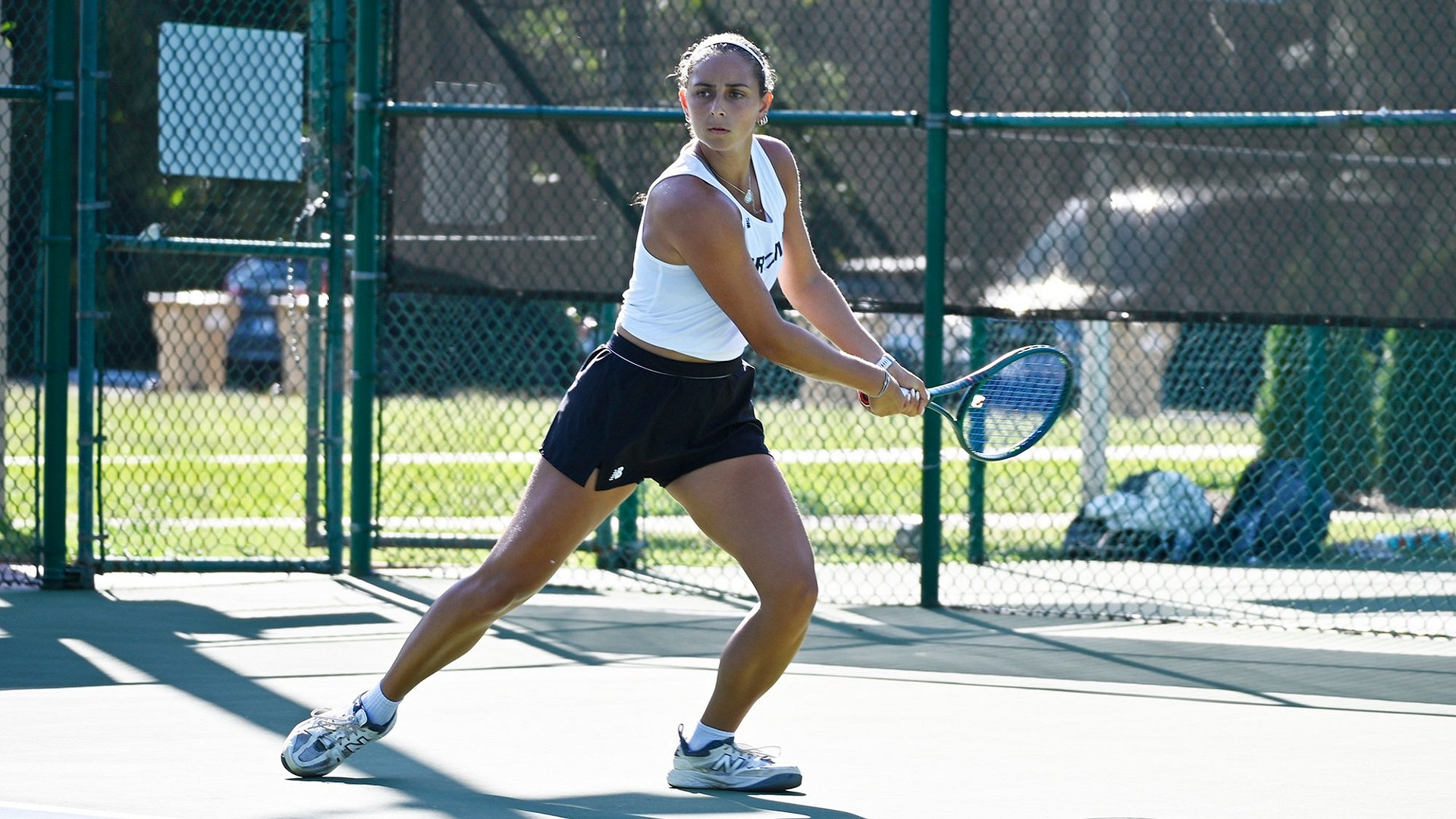 Noy hitting a backhand shot and admiring it