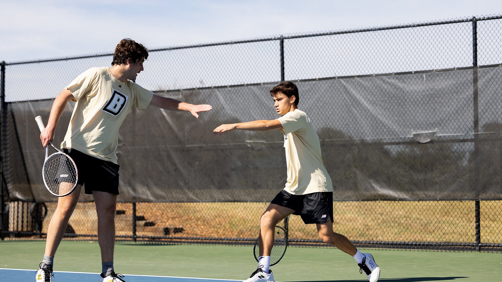Baquero and Machado high five after a point