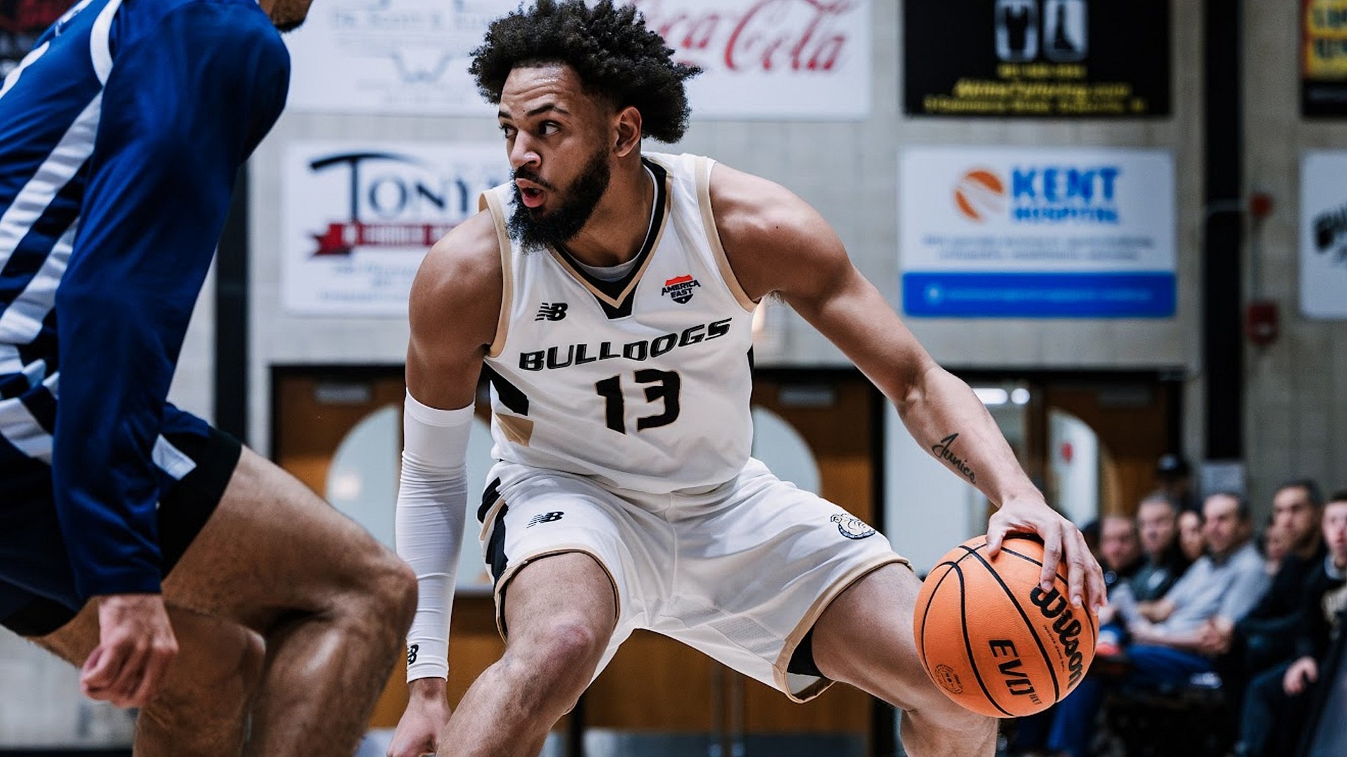 Jakai Robinson Dribbles against a defender from Mercy