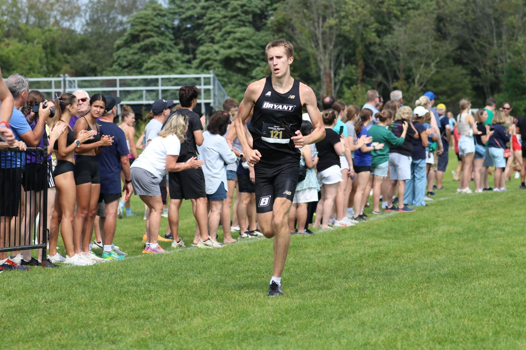 Andrew McConnell running toward the finish line