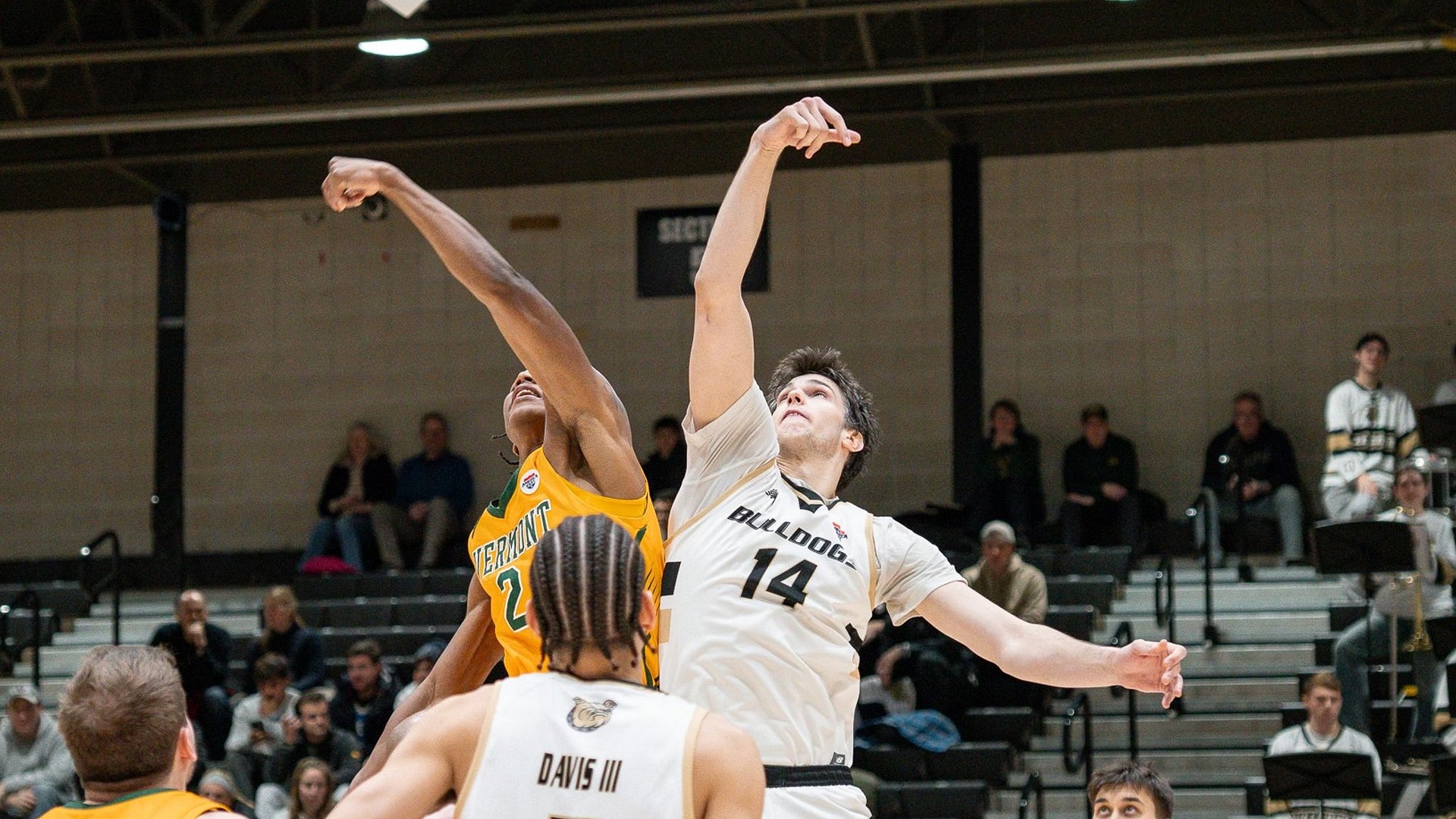 Keegan Harvey battling for the opening tipoff vs. UVM at home