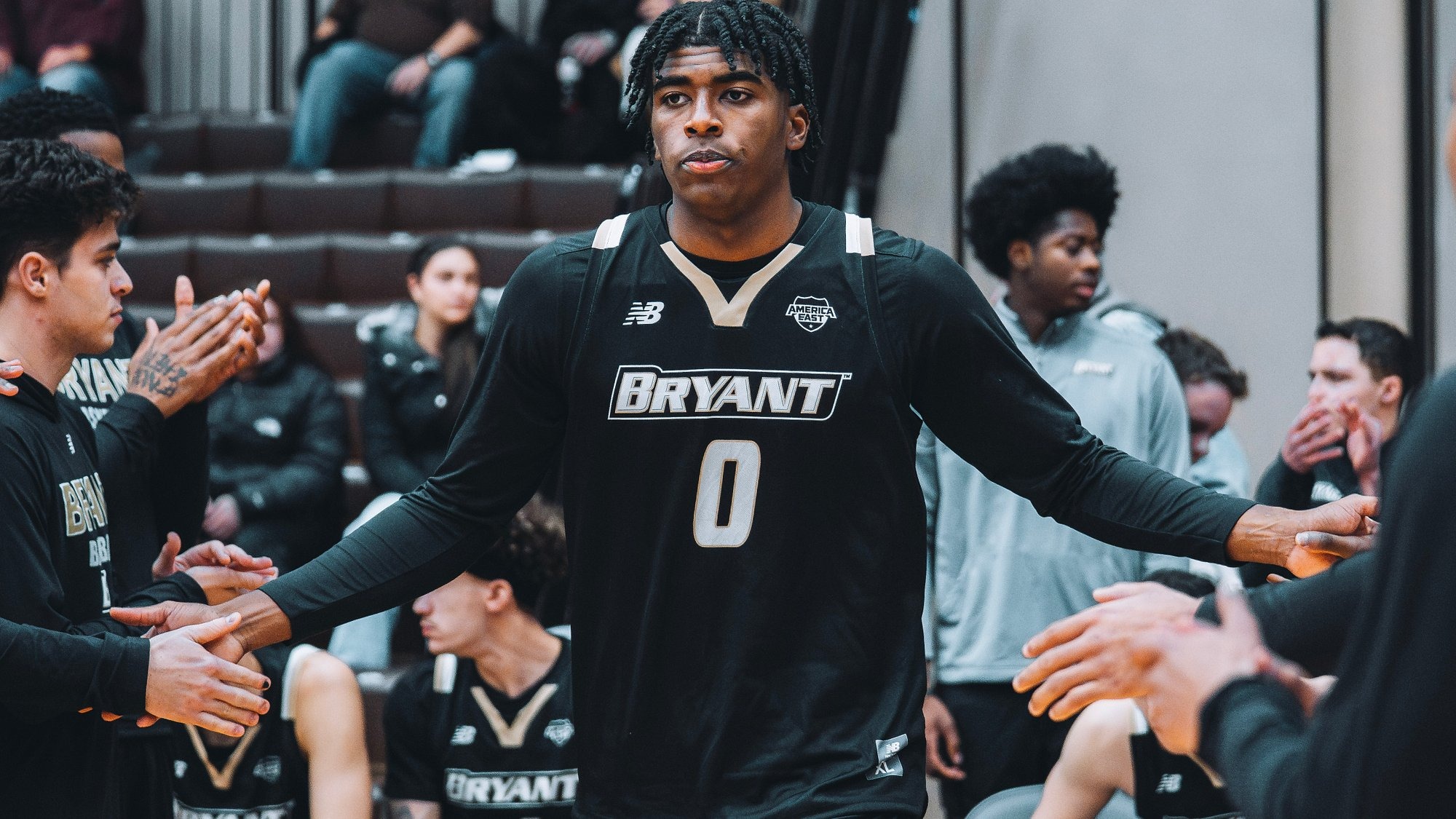 Ashley Sims High Fives teammates as he's announced as a starter