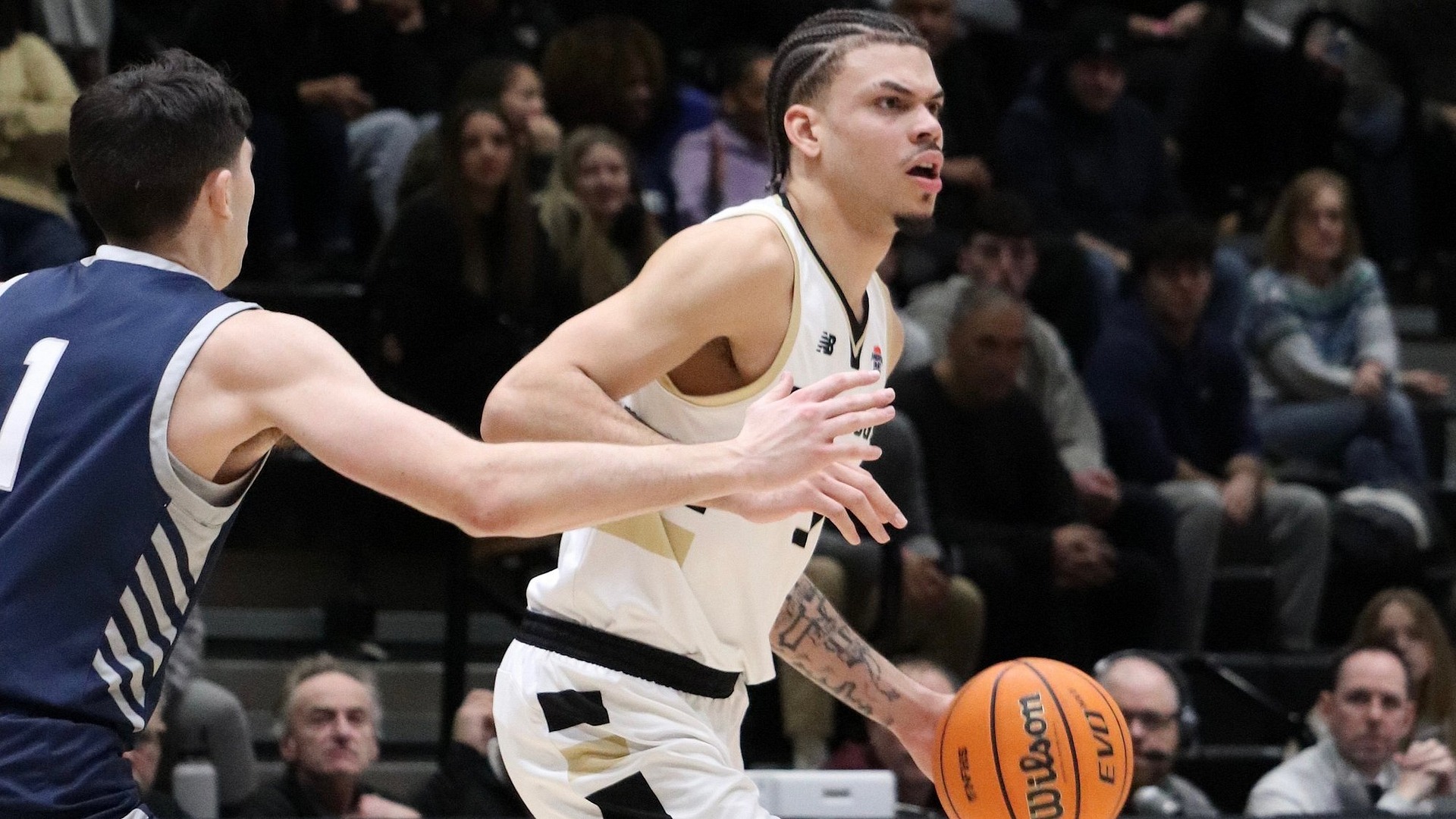 Aaron Davis battling against UNH defender