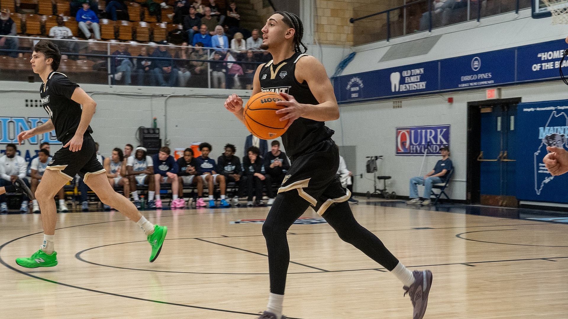 Ty Tabales Dribbles the Ball up the court at Maine