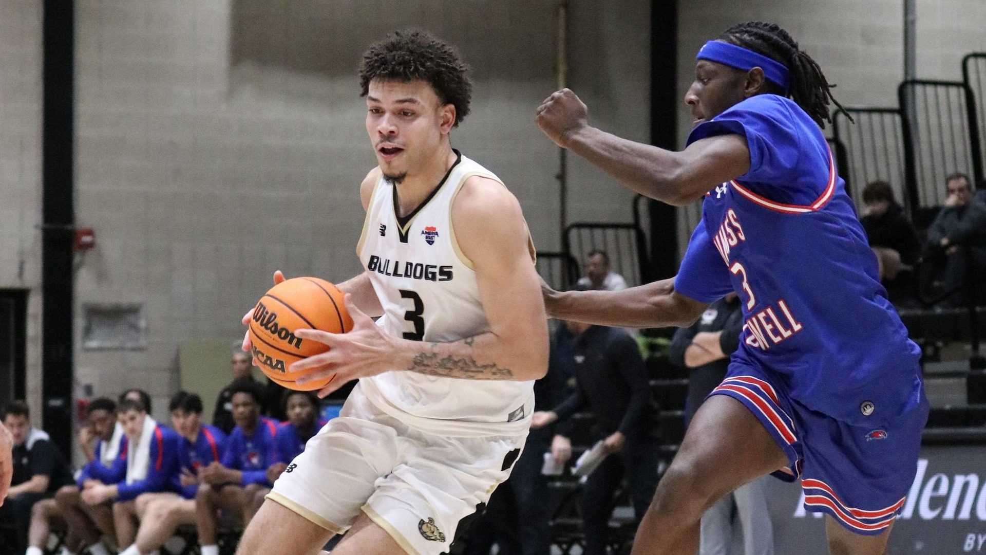 Aaron Davis drives against a UML defender