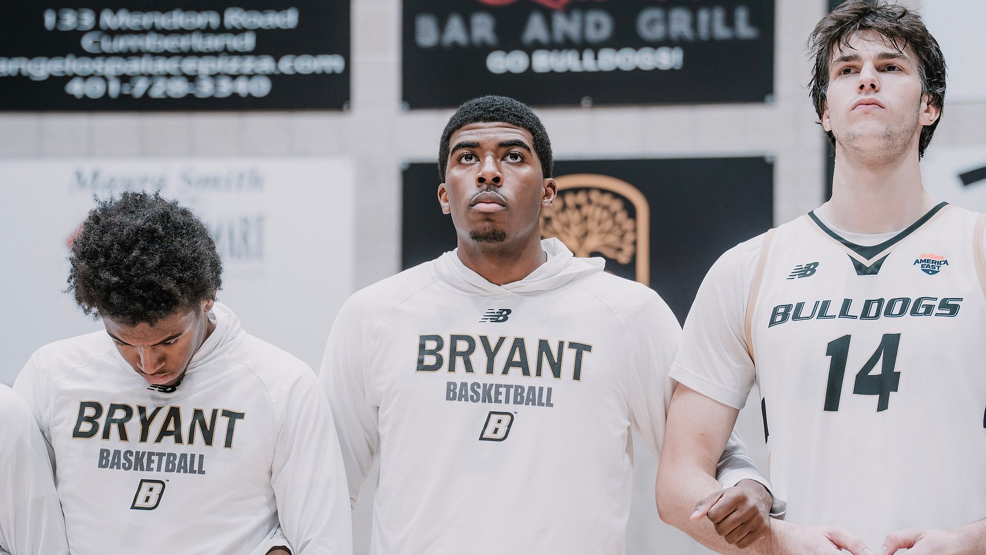 Team Pregame Stands Arm in Arm in League Play