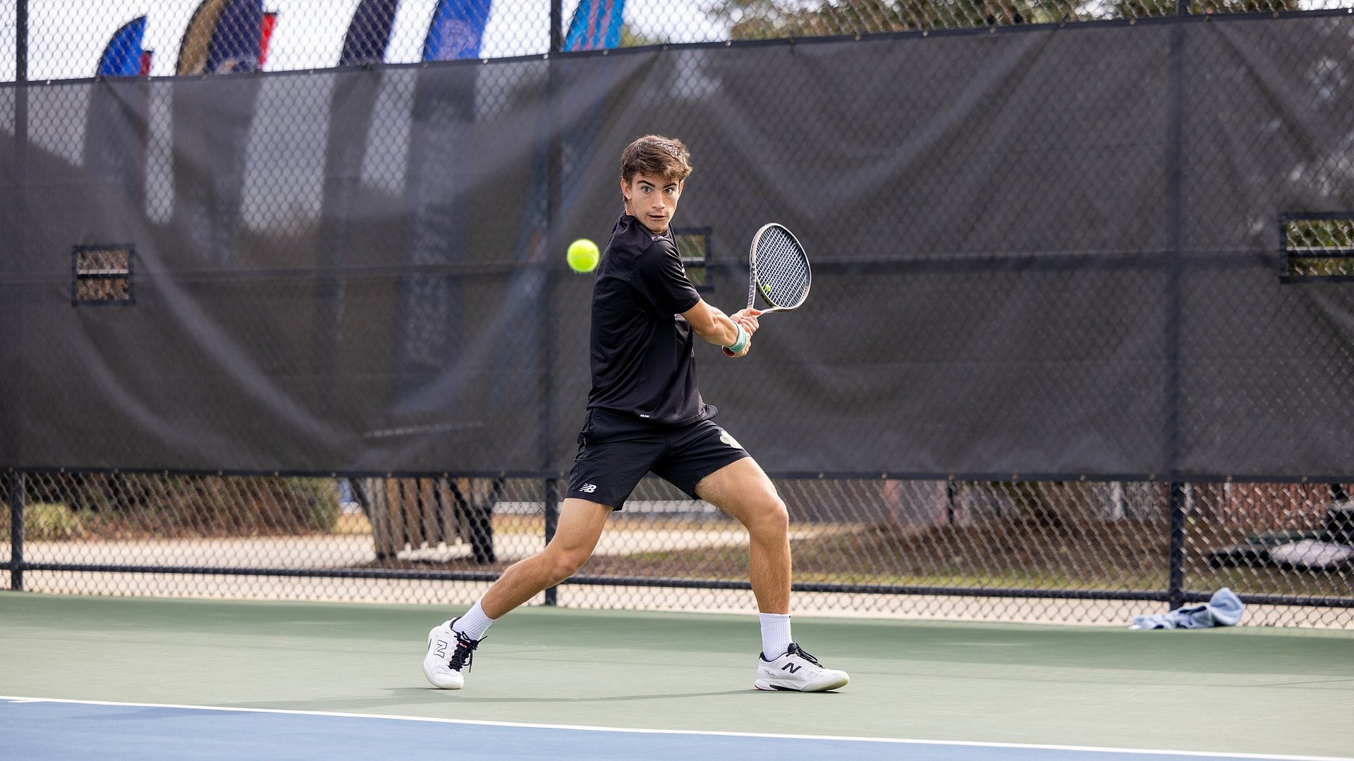 Miguel Machado taking a backhand 