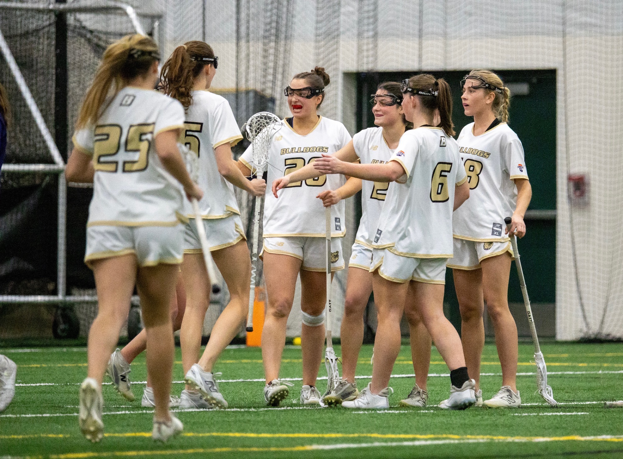 Team celebrates a goal  vs Stonehill