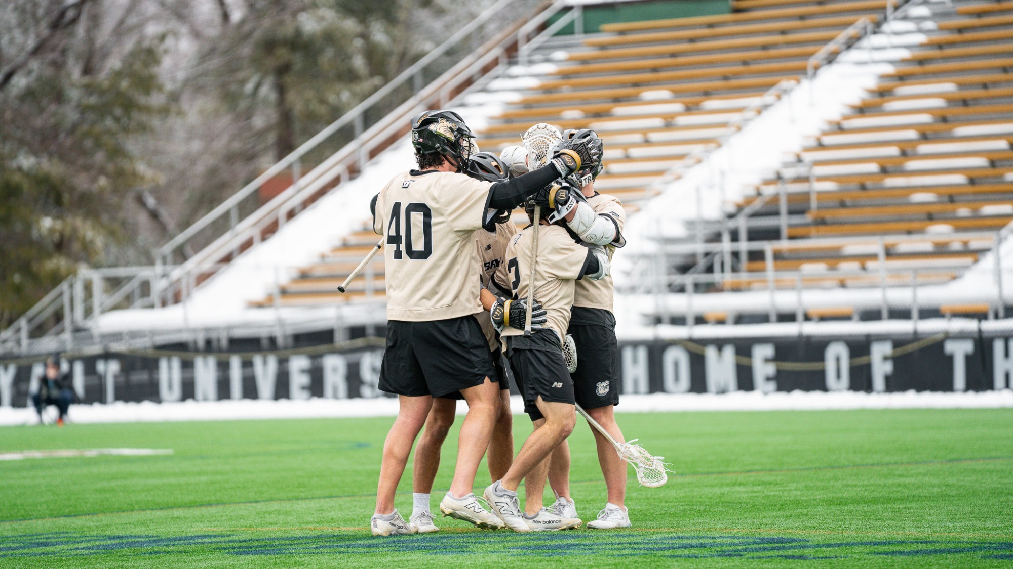 The team celebrates in a huddle at the end of the match