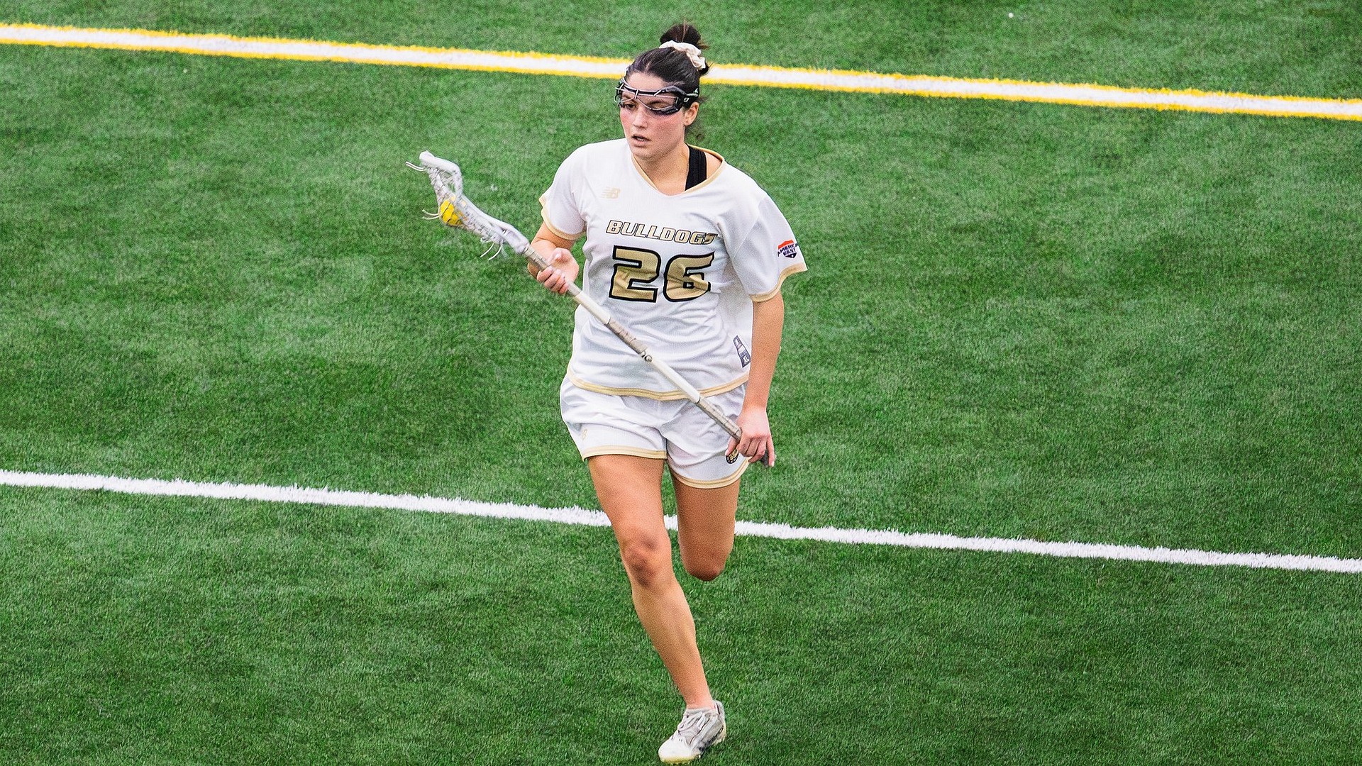 Emily DeGeorge carrying the ball upfield 