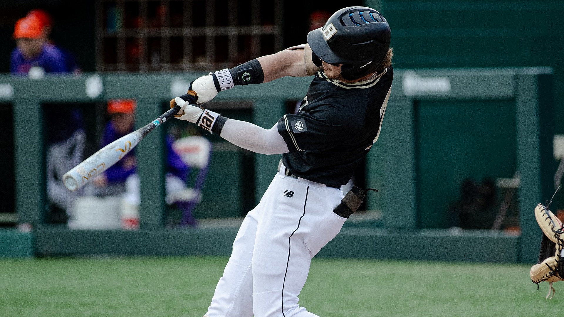gavin greger swings at a pitch against clemson