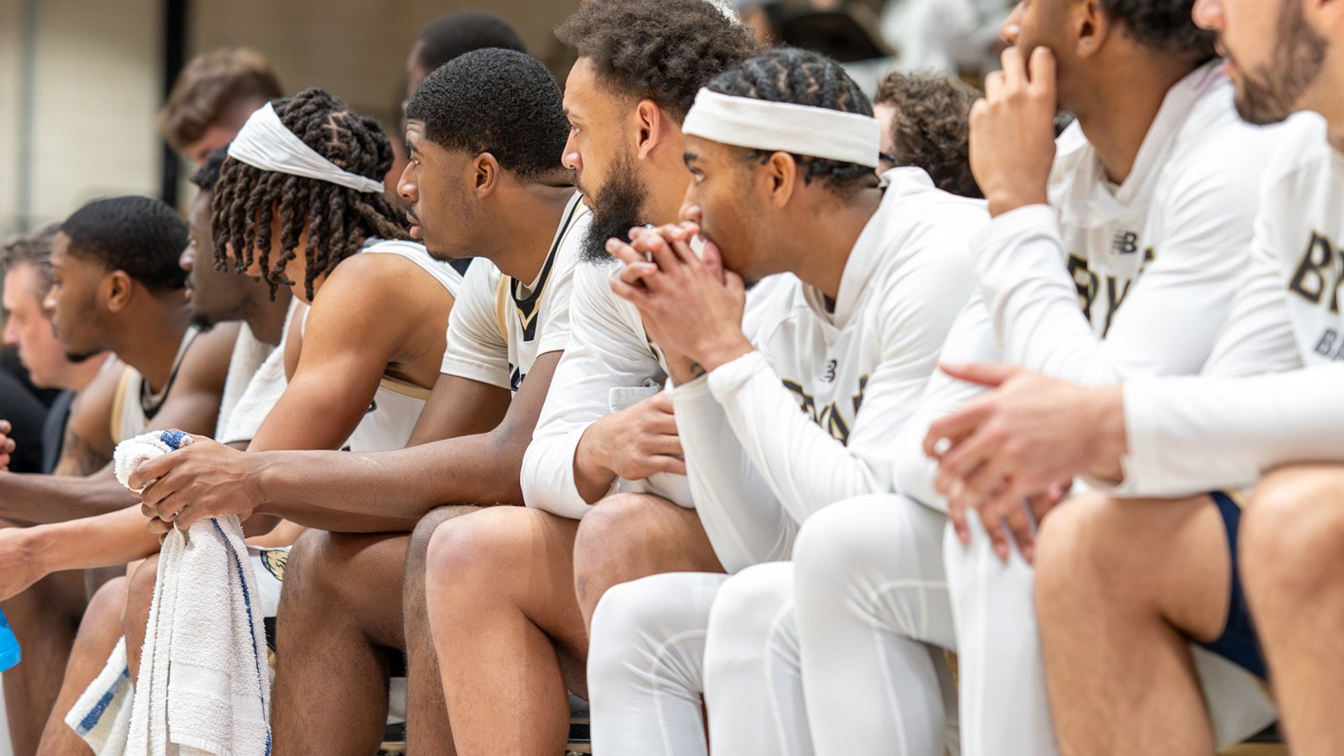 Bryant players look on from the bench
