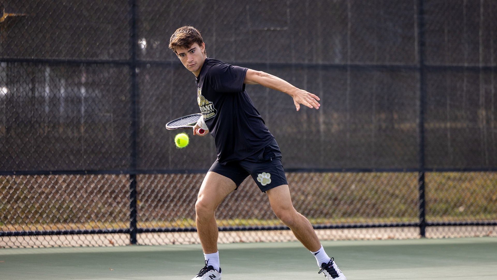 Miguel Machado preparing to hit a forehand shot