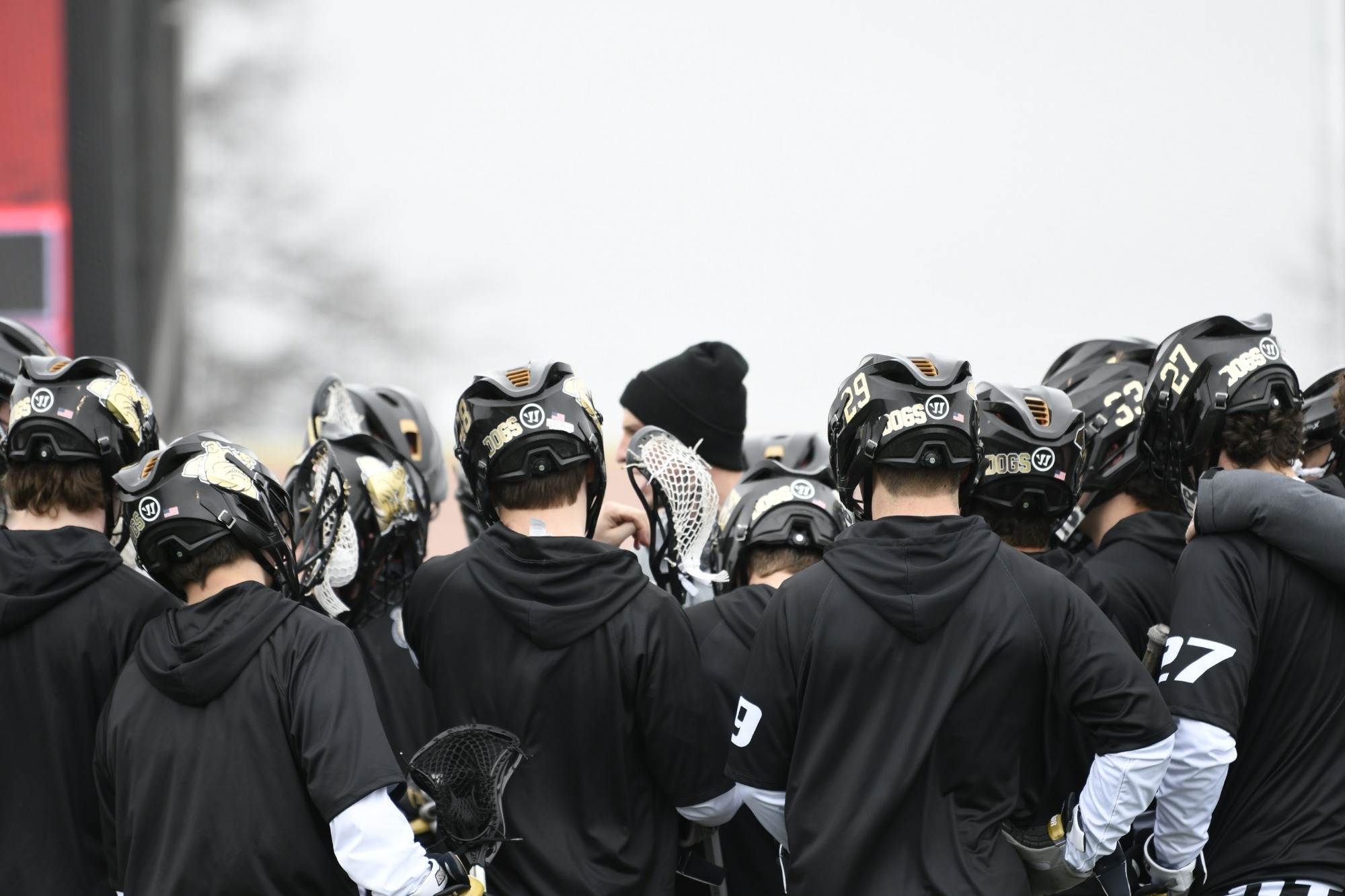 Men's Lacrosse huddle, team comradery