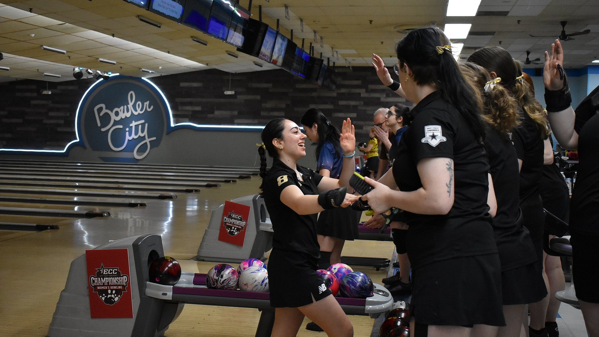 Bowling team celebration on Day 1 of ECC Champs