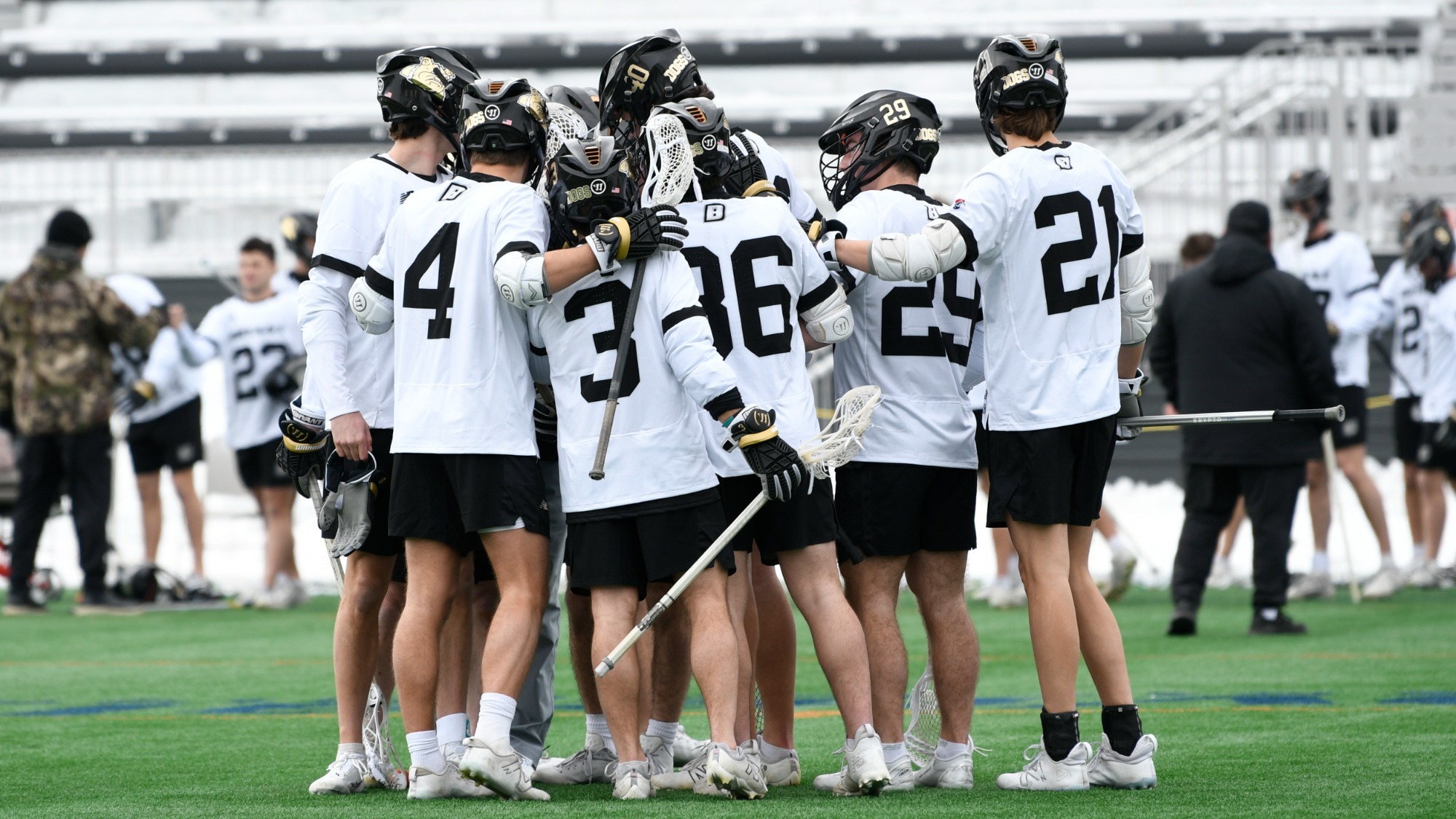 bryant men's lacrosse huddle ahead of the upcoming match