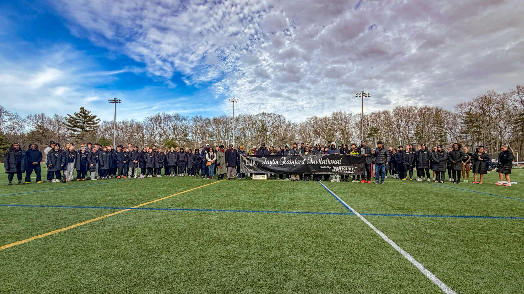 the bryant university track and field team commemorating the life of Jaylin Rainford