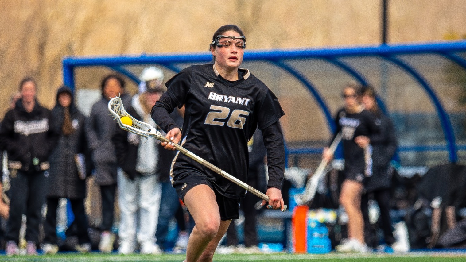 Gabby Constant runs up the field with the ball vs UML