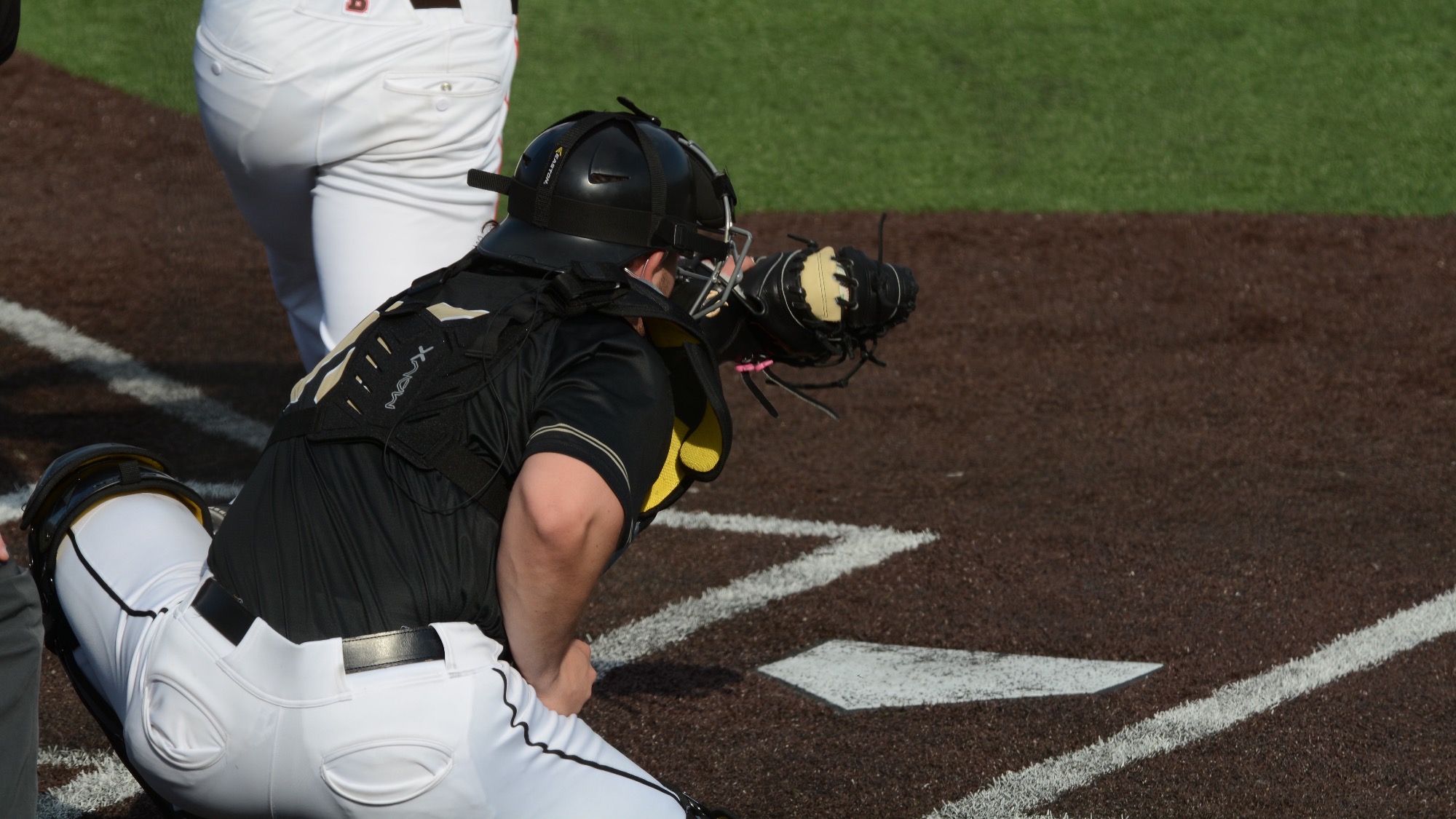 JG catches a pitch against Brown