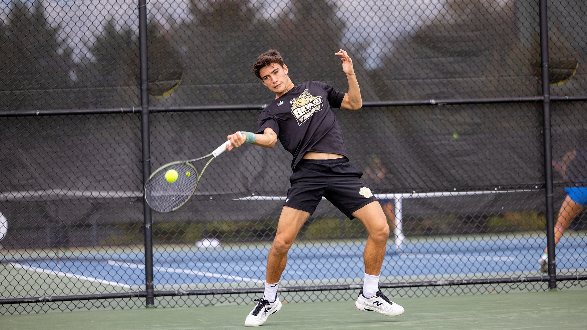 Miguel Machado preparing to hit a forehand shot
